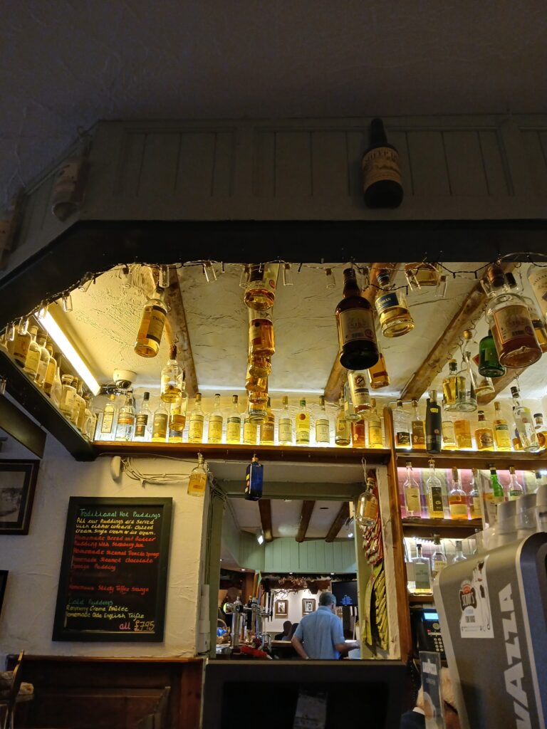 The bar with bottles of Whiskey on display