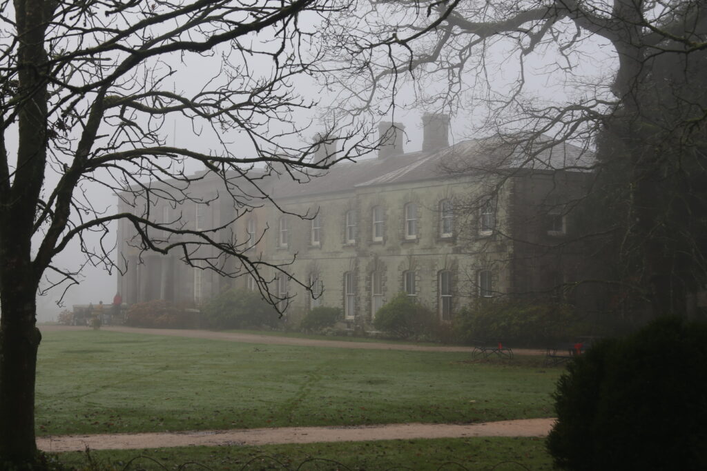 A view of the grand house in the mist