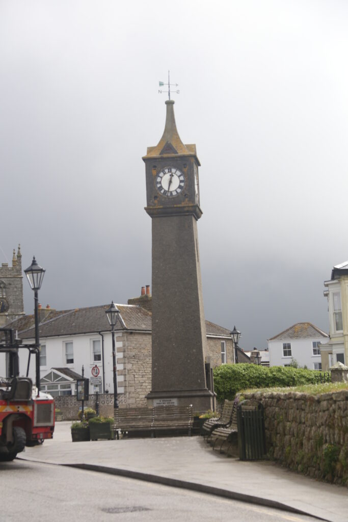 Clock tower against a cloudy grey backgound