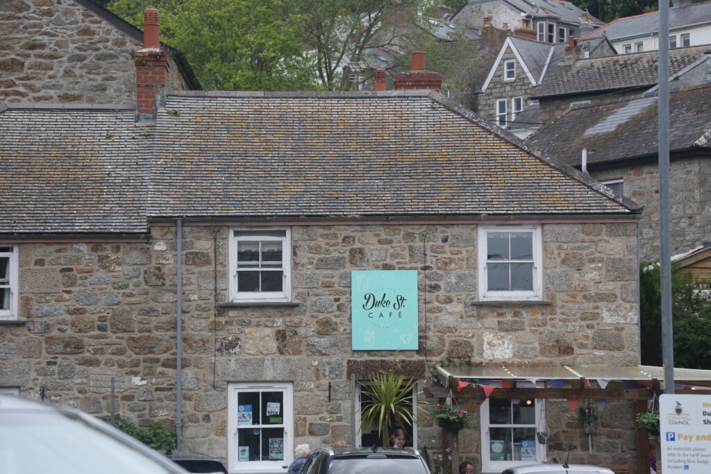 Stone building with slate roof and Logo for Duke Street Cafe